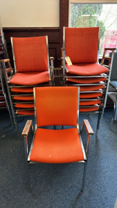 12 Orange Stacking Arm Chairs