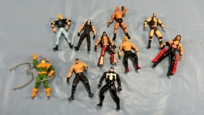 Approximately 9 Metal & Plastic Wrestling Figures